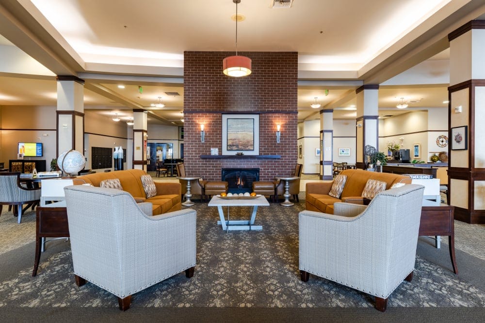 Welcoming common area with couches and a fireplace.