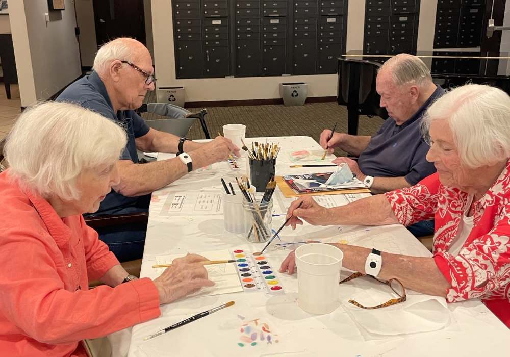 Residents engaged in a painting activity