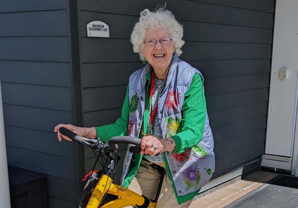 Senior woman smiling with a walker