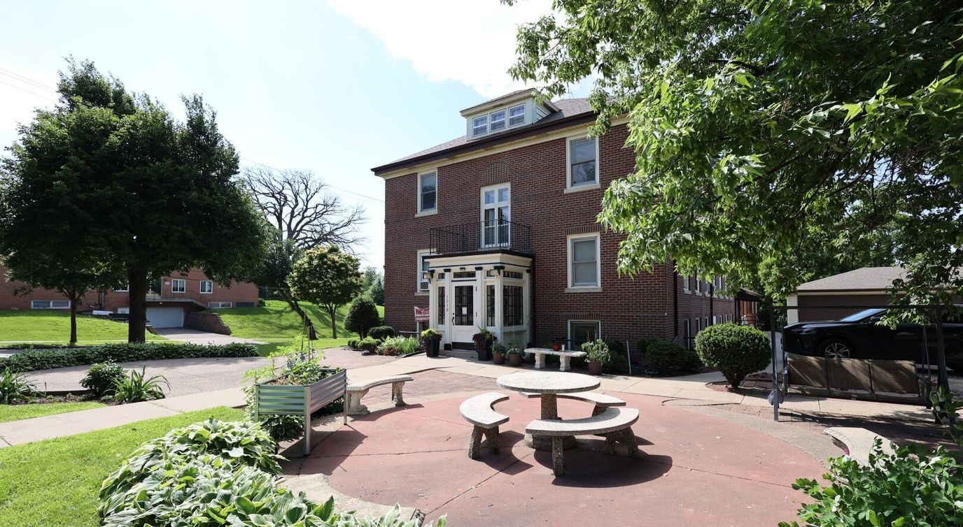 Outdoor courtyard with seating at a senior living facility