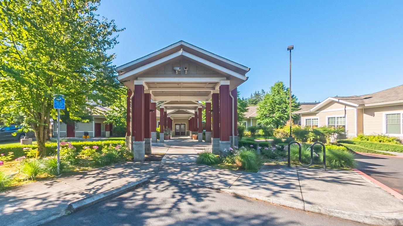 Welcoming entrance of Avalon Care Center with landscaping