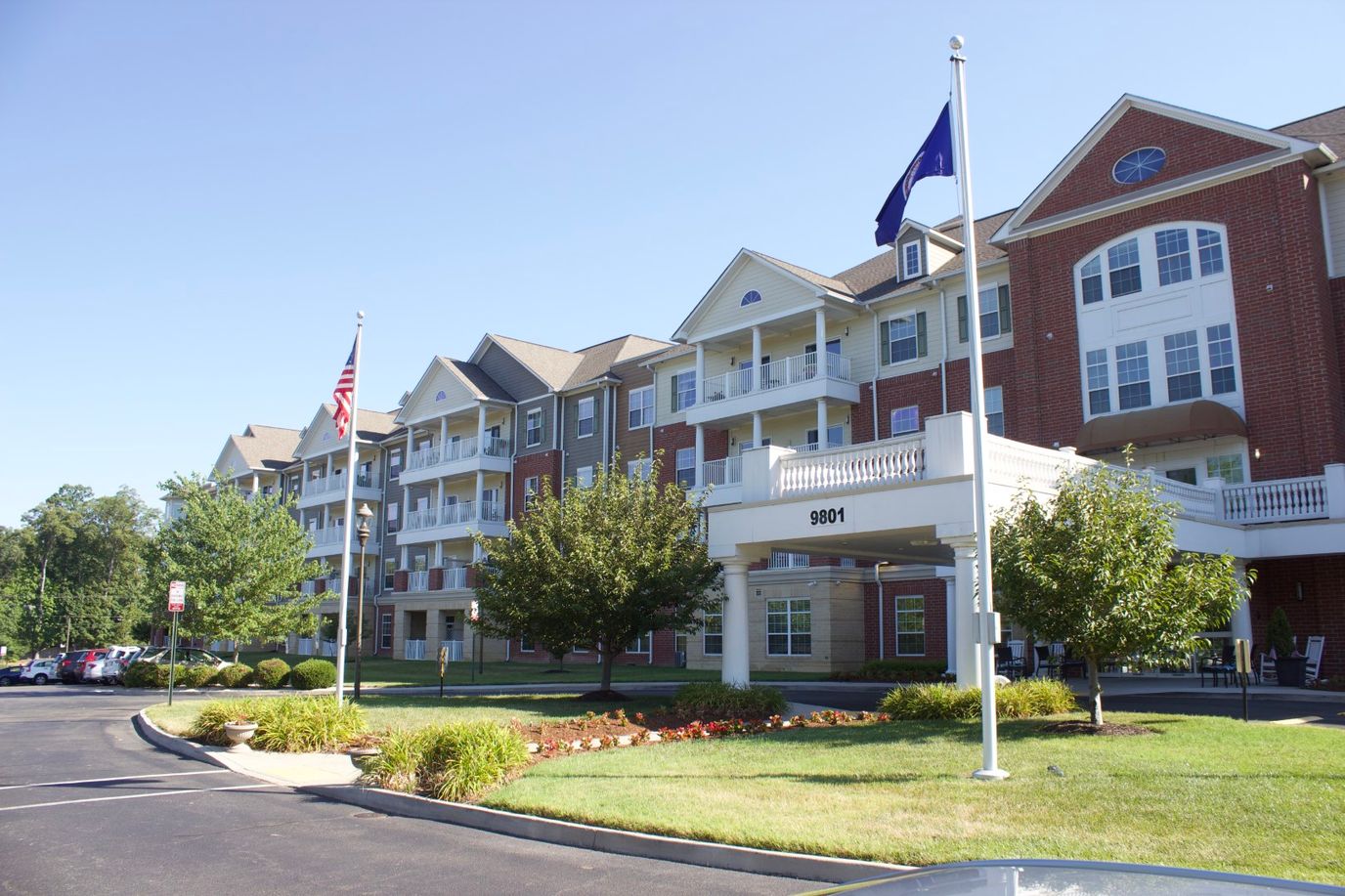 Front exterior of Discovery Village facility with landscaping