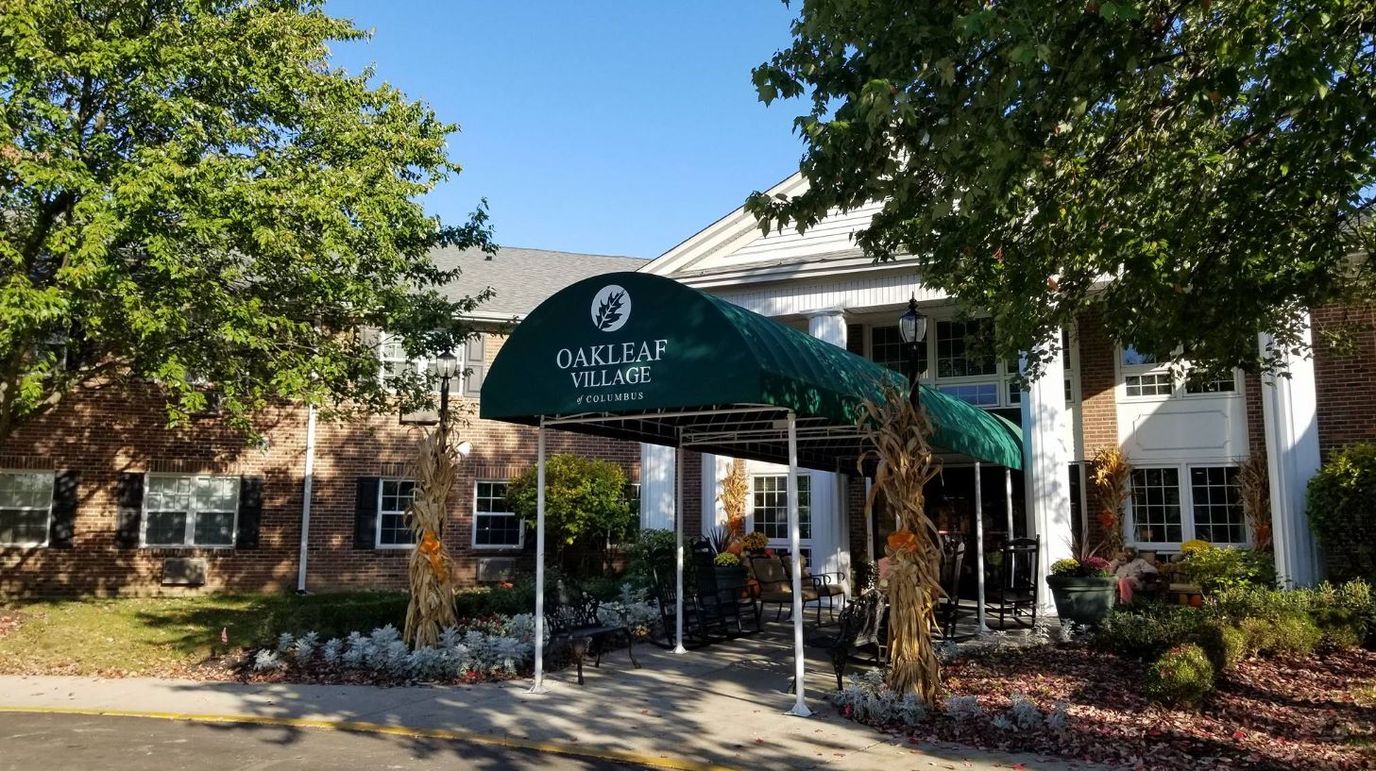 Exterior view of Oakleaf Village entrance with awning