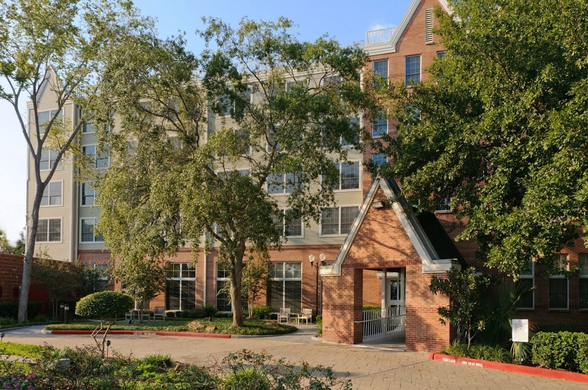 Exterior view of The Vosswood Nursing Center surrounded by trees