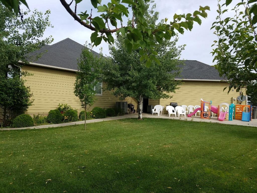 Exterior view of a facility with outdoor seating