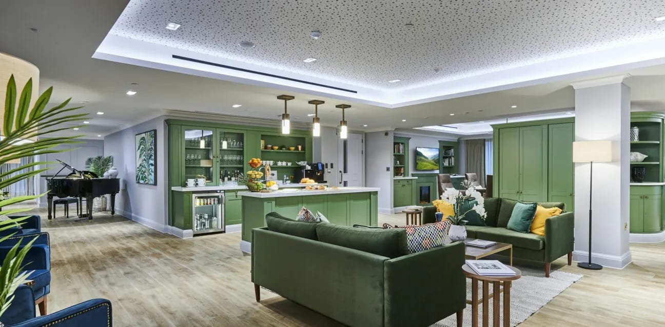 Bright common area with seating and piano