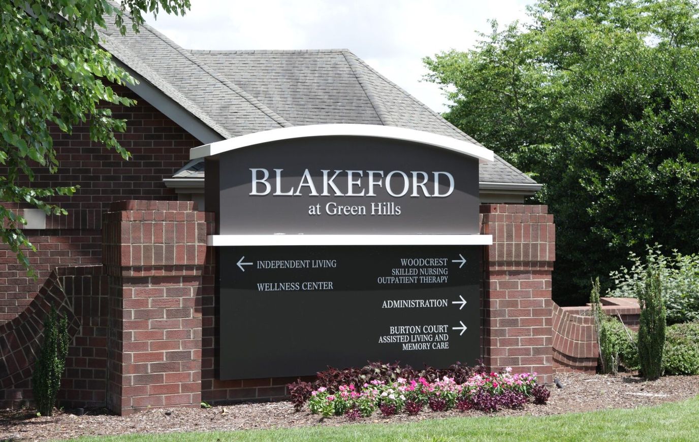 Sign directing to various areas of the facility