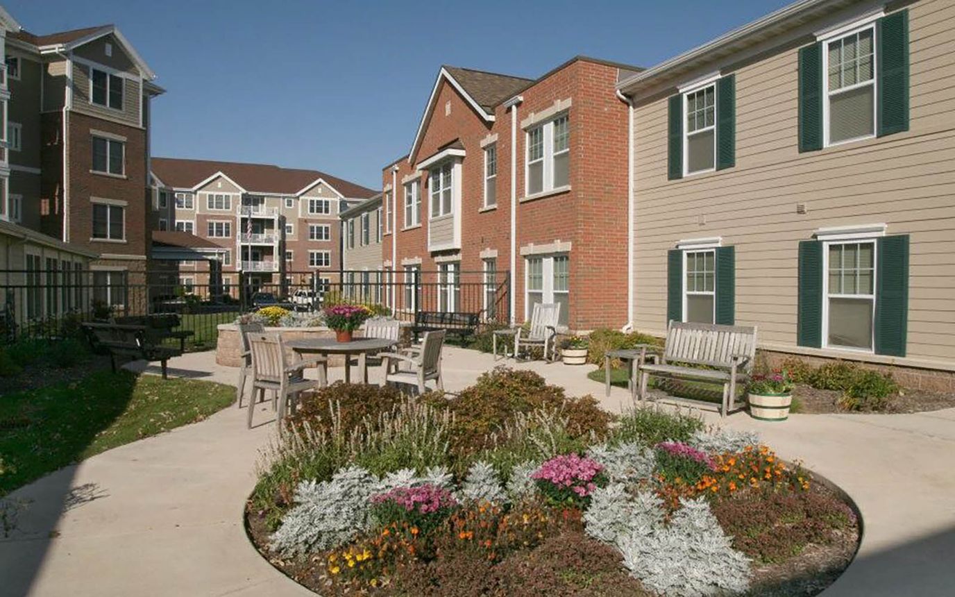 Outdoor space with seating and flower beds