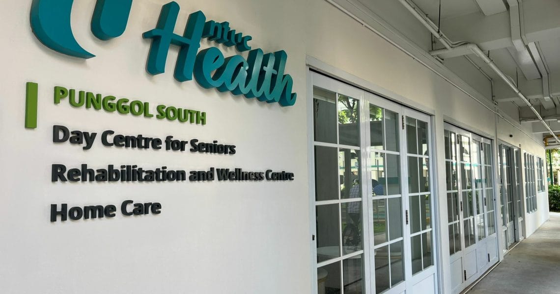 Exterior view of NTUC Health facility signage