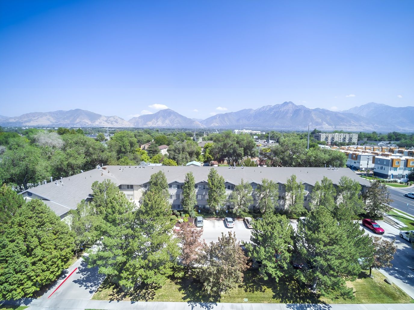 Aerial view of the facility with mountains in the background
