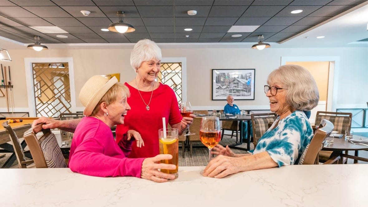 Residents enjoying drinks in a common area