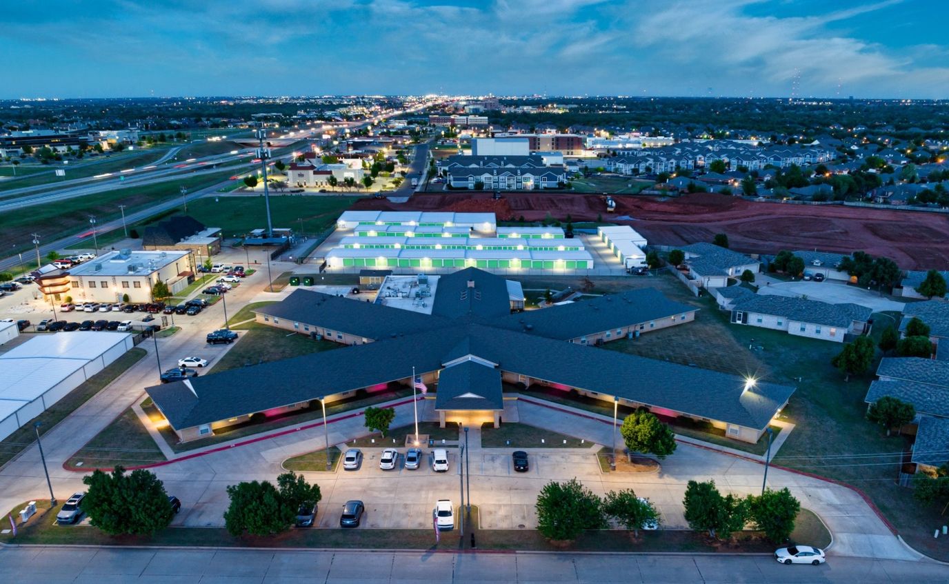 Aerial view of a senior living facility at dusk