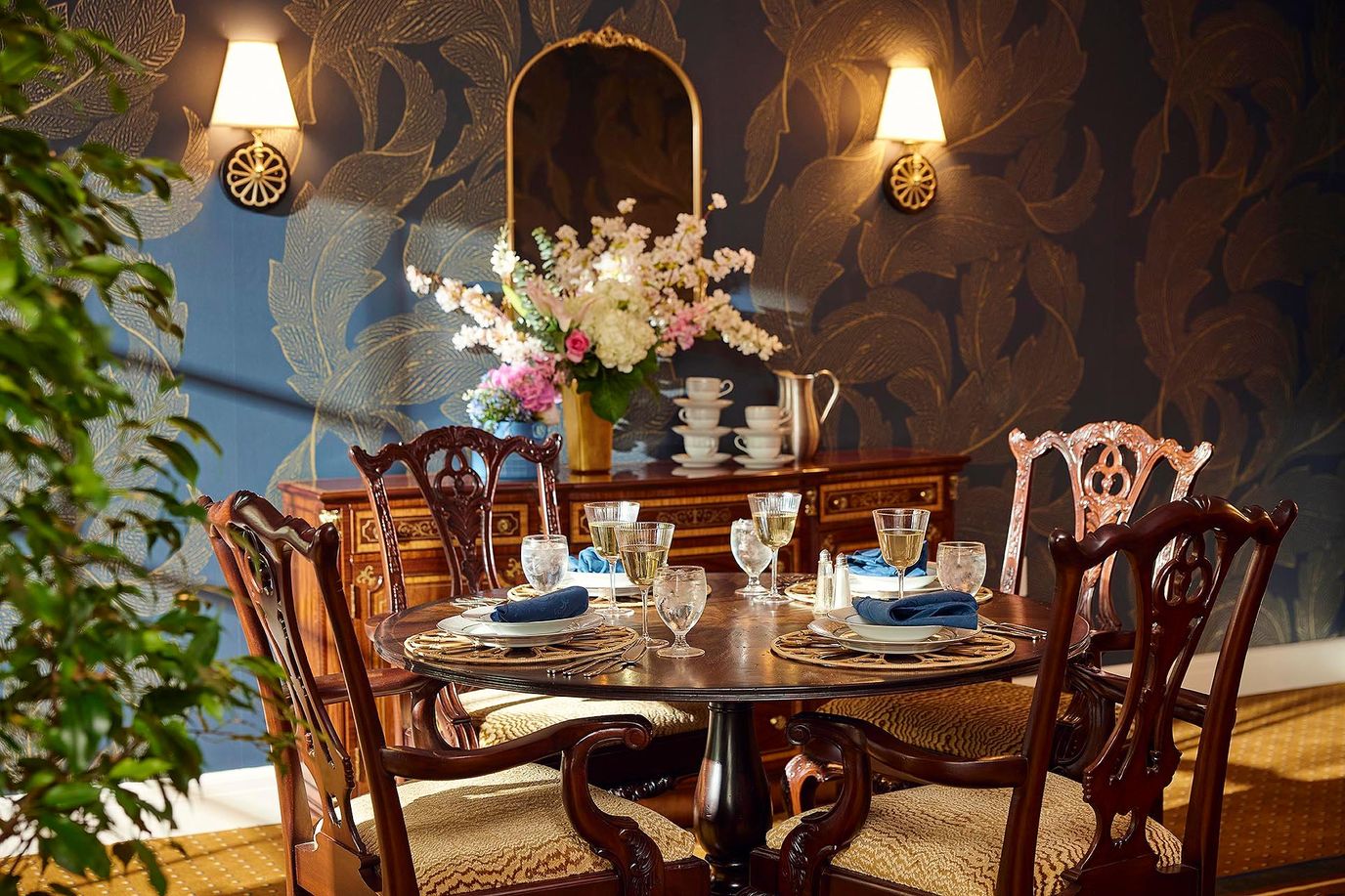 Elegant dining room setup with flowers and table settings