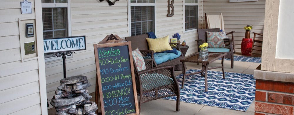 Welcoming outdoor seating area with activity schedule