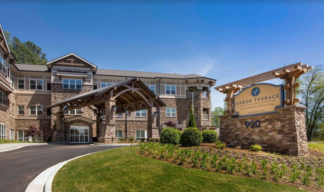 Exterior view of Arbor Terrace building with landscaped entry