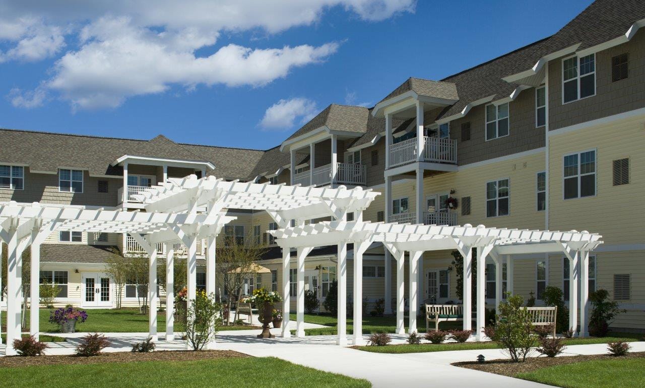 Outdoor courtyard with pergolas and landscaping