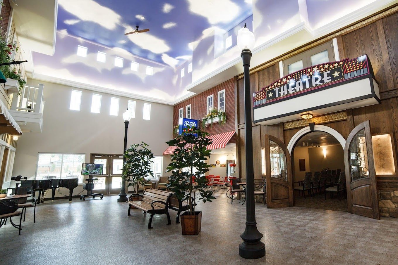 Interior common area with benches and theatre entrance