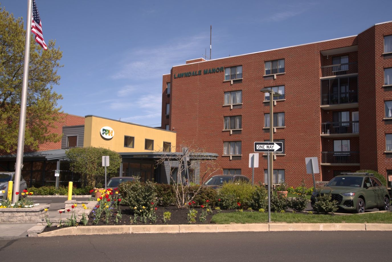Exterior view of the facility with gardens and entrance