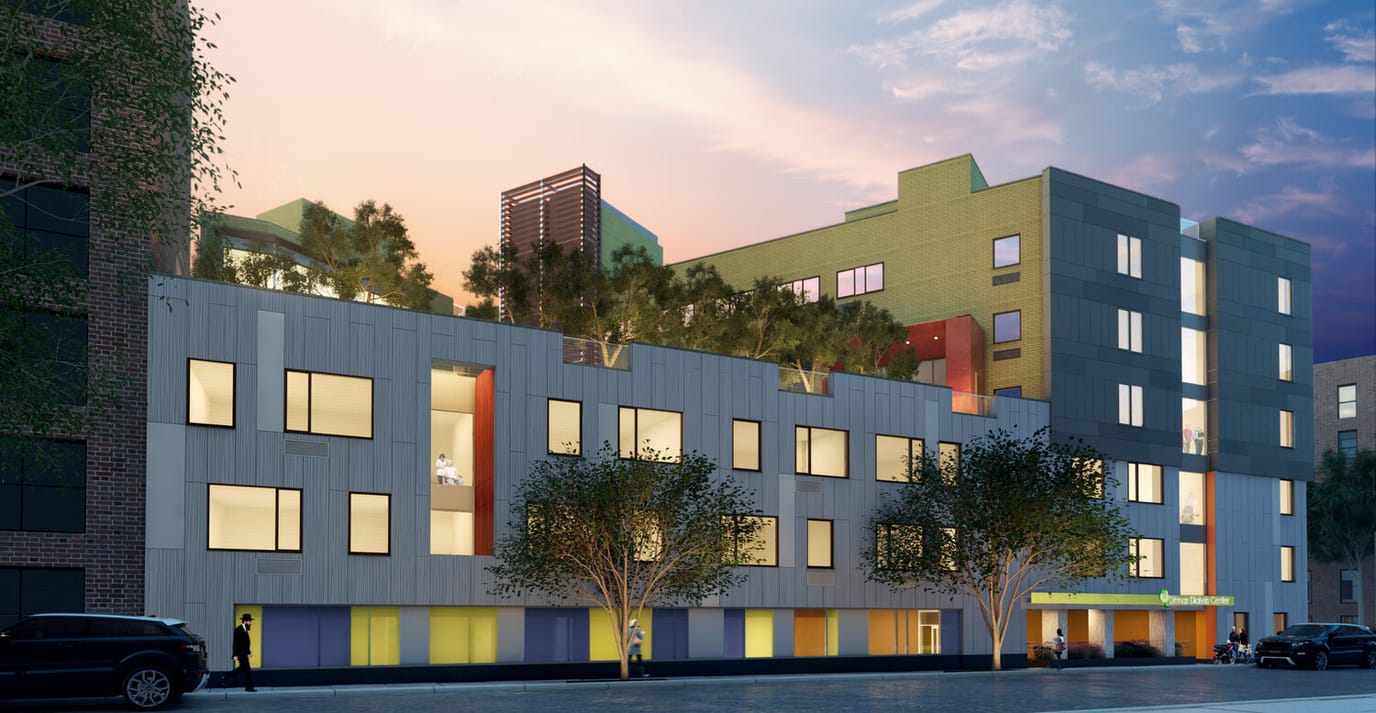 Modern nursing facility building exterior at sunset