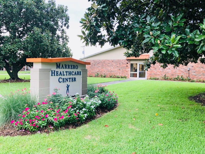 Exterior view of Marrero Healthcare Center sign and building