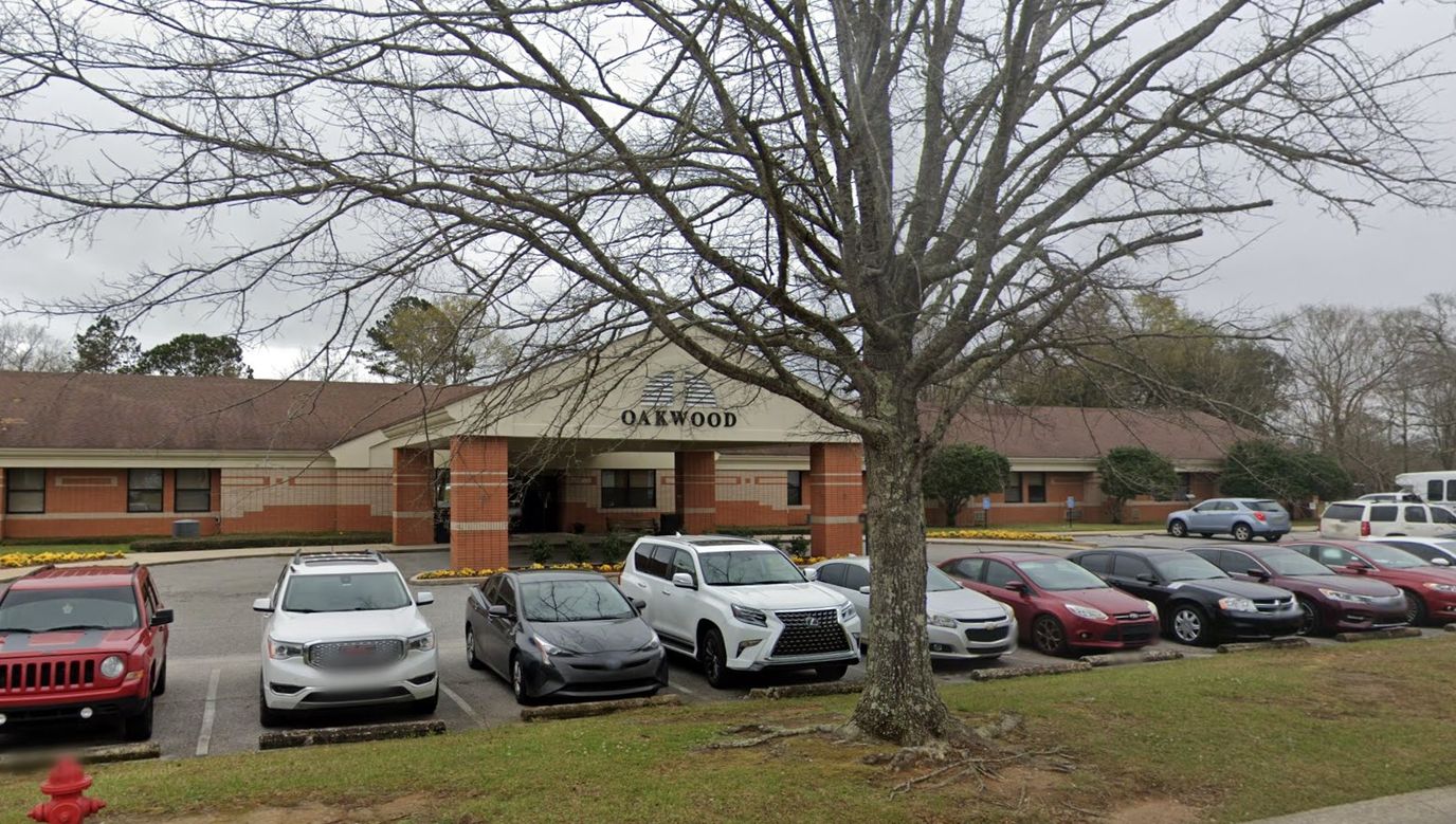 Exterior view of Oakwood facility with parking lot