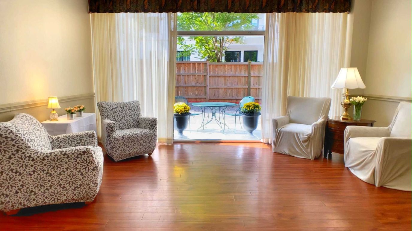 Bright common area with seating and natural light