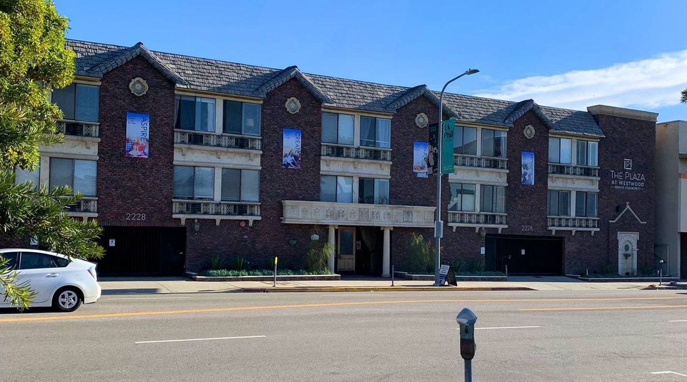Exterior view of The Plaza at Westwood Senior Living building