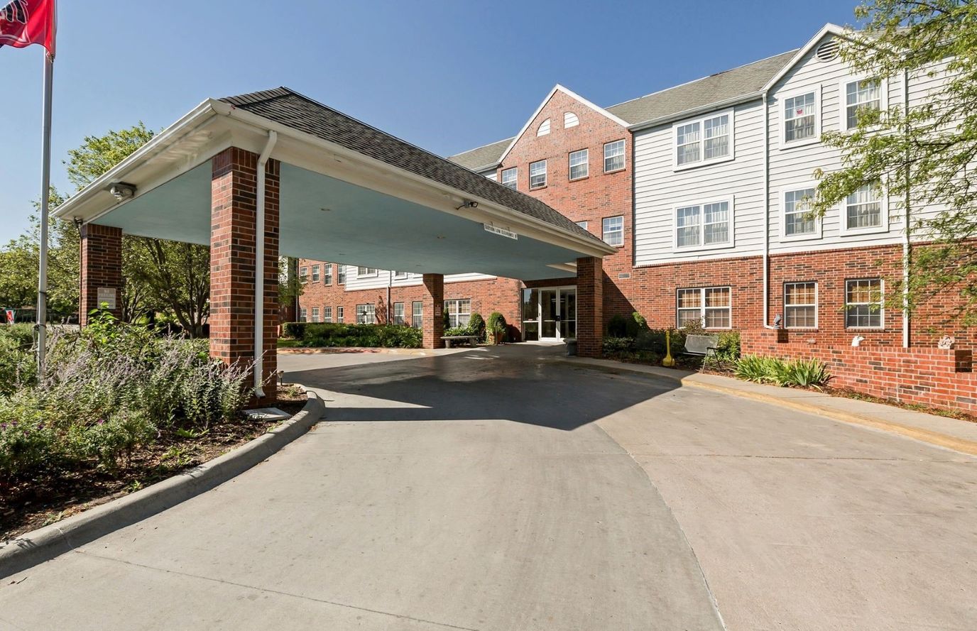 Driveway leading to a senior living facility entrance