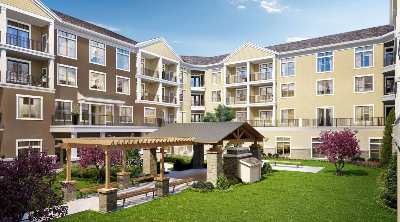 Outdoor courtyard area with seating and landscaping
