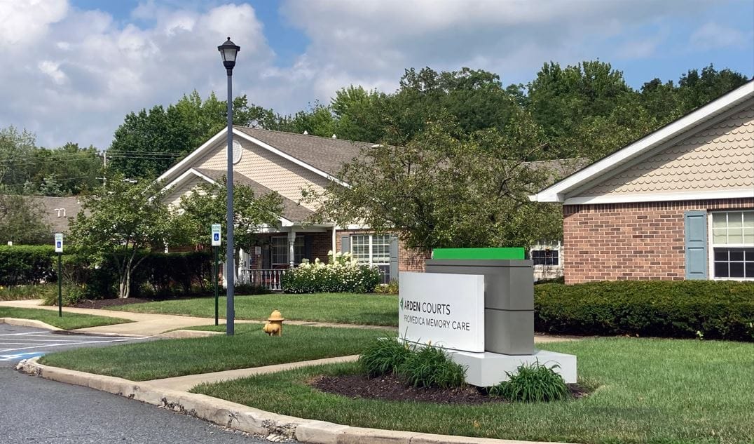 Exterior view of Arden Courts facility signage and building