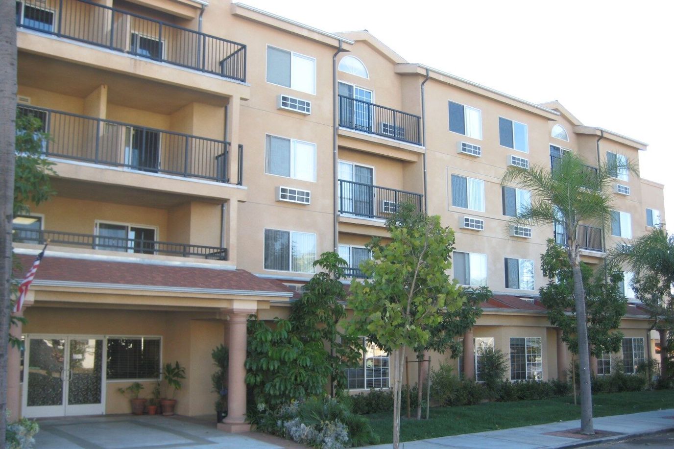Exterior view of a senior living facility with balconies