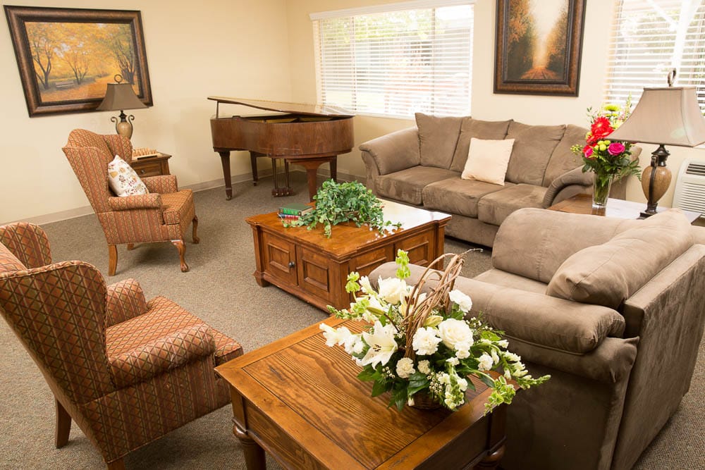 Cozy common area with seating and piano