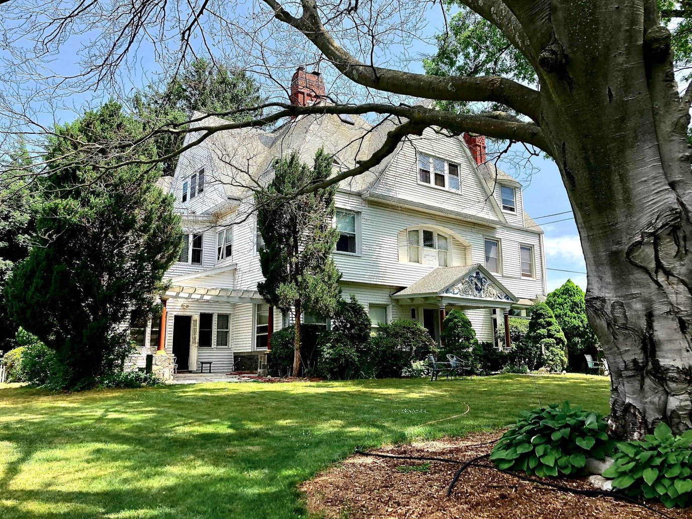Exterior view of Gladhaven Senior Residence surrounded by landscaped grounds