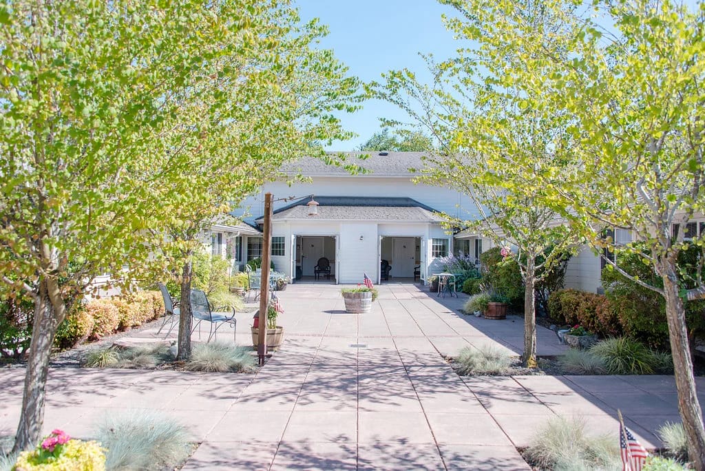 Exterior view of Tierra Rose Care Center with landscaping