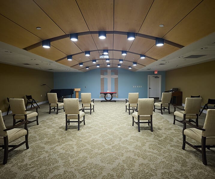 Bright activity room set up with chairs