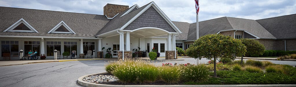 Front entrance of the Heritage Pointe facility with garden