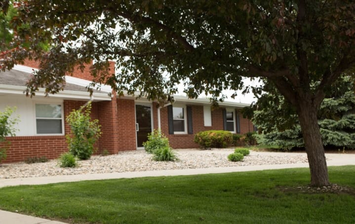 Exterior view of a nursing home facility with landscaping