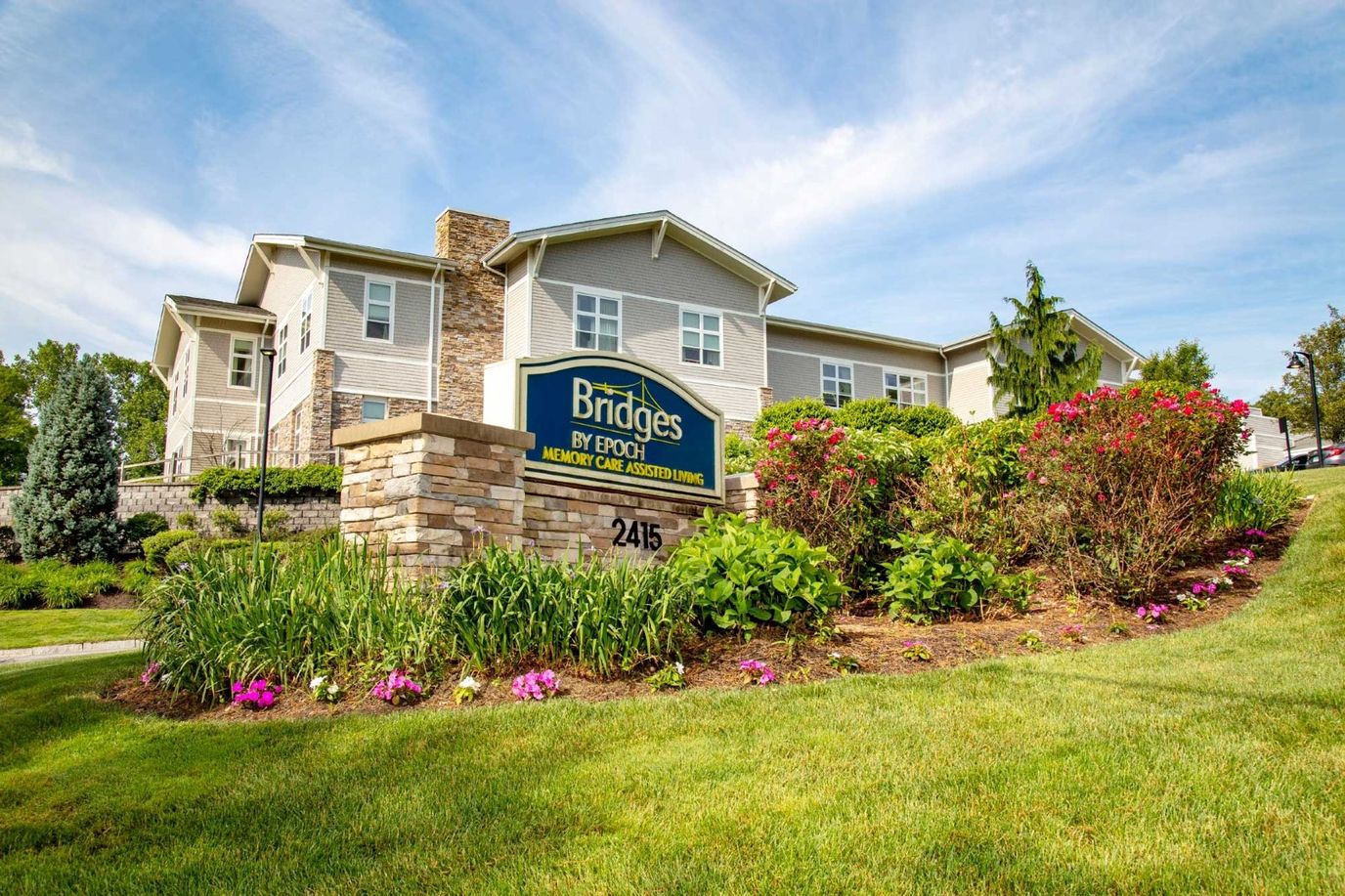 Exterior view of the assisted living facility with landscaping
