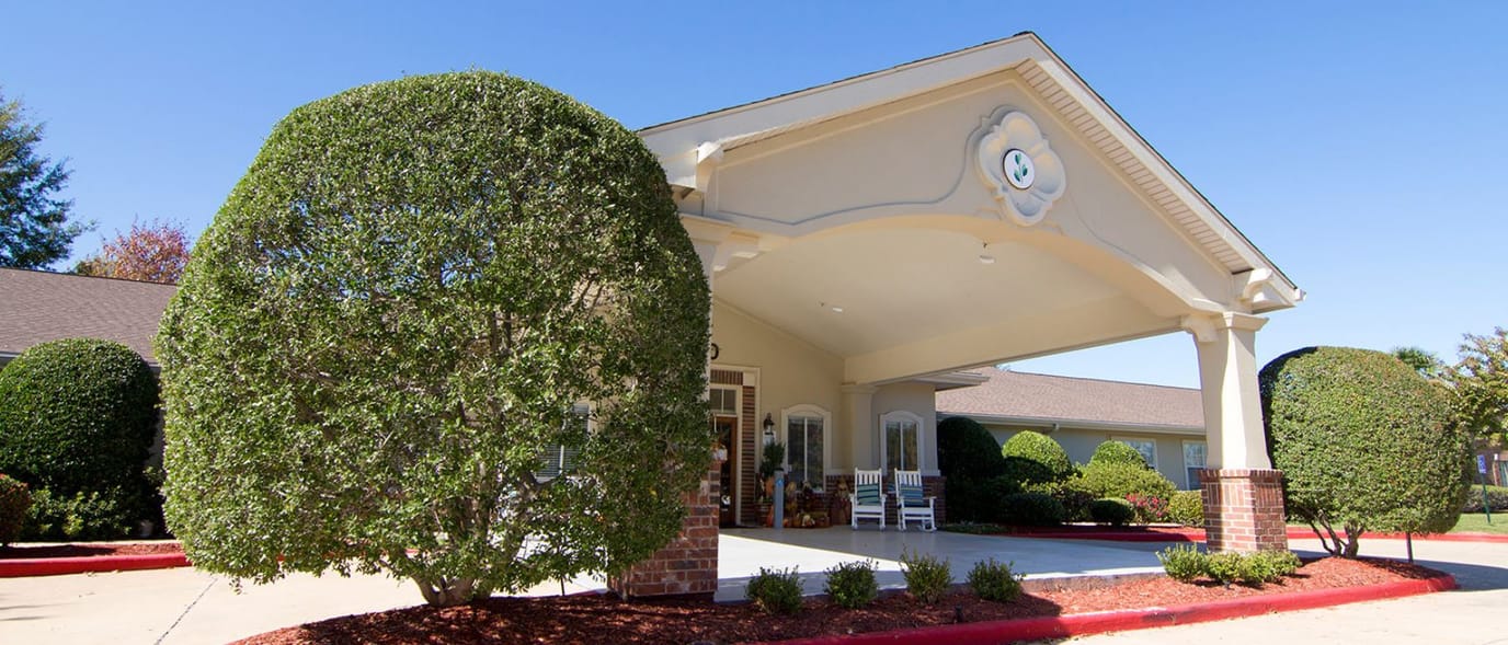 Exterior view of the entrance with landscaping