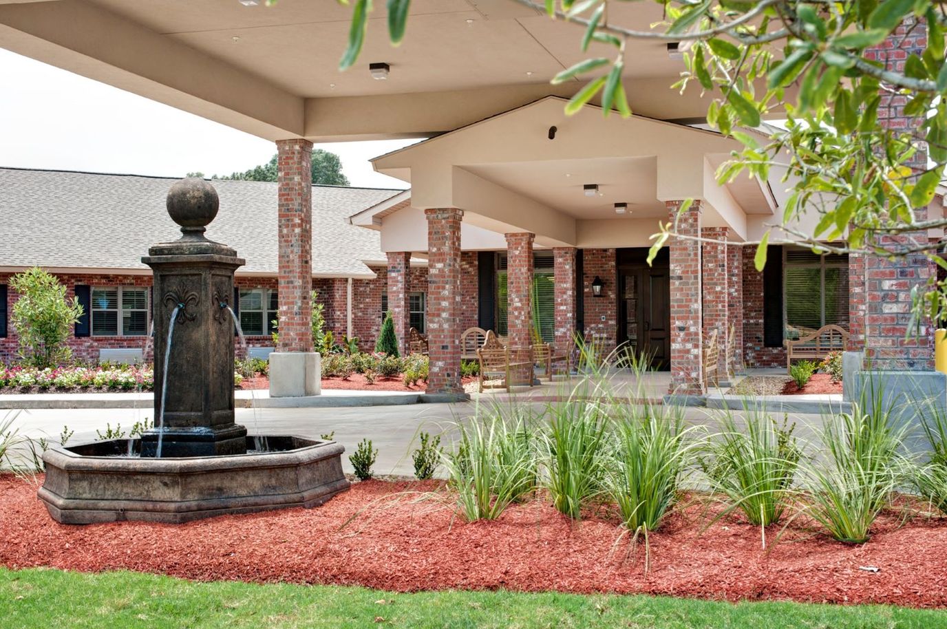 Exterior view of the facility entrance with fountain