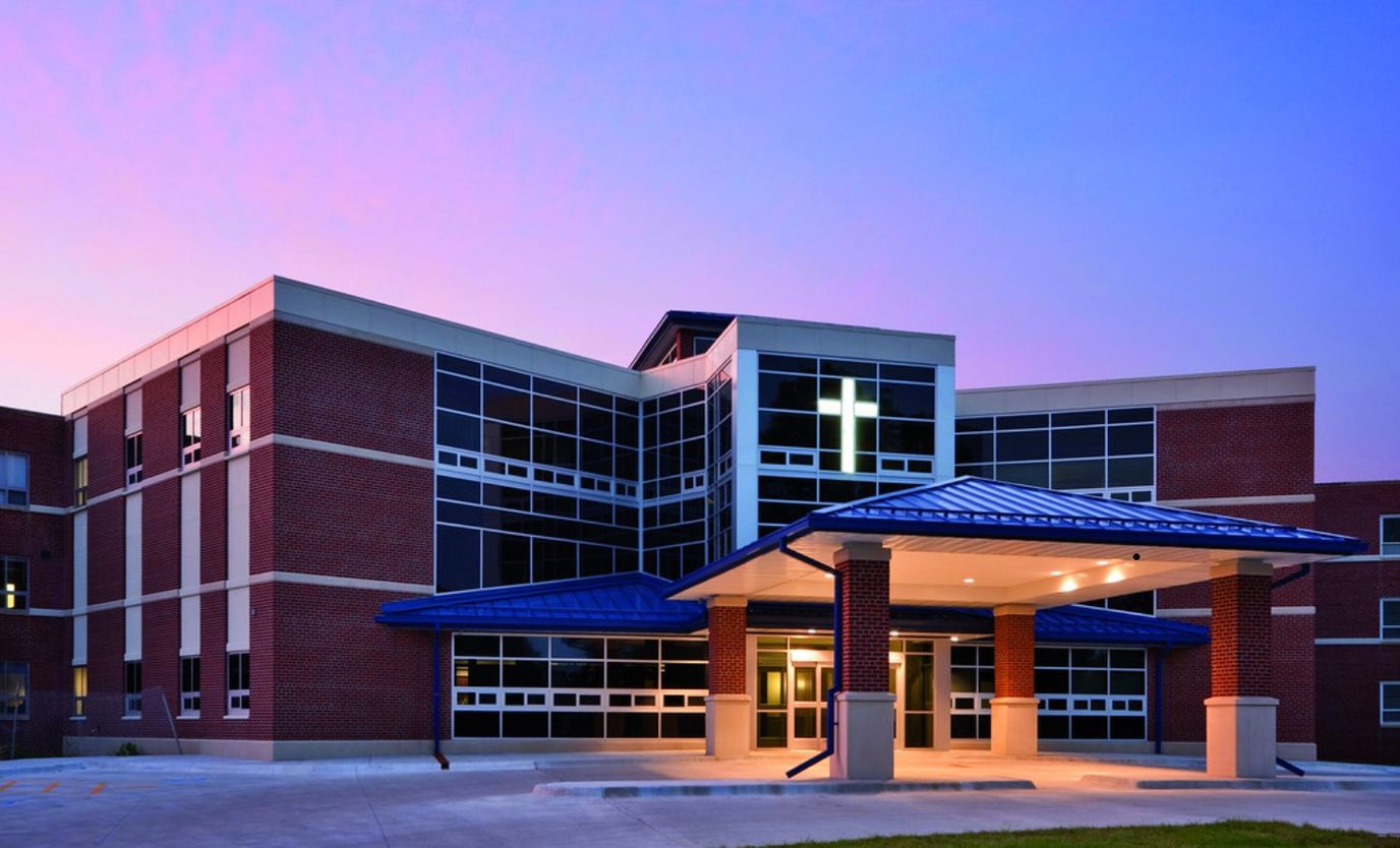 Exterior view of a nursing facility at dusk