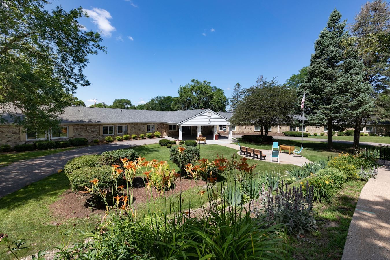Exterior view of the facility with landscaped grounds