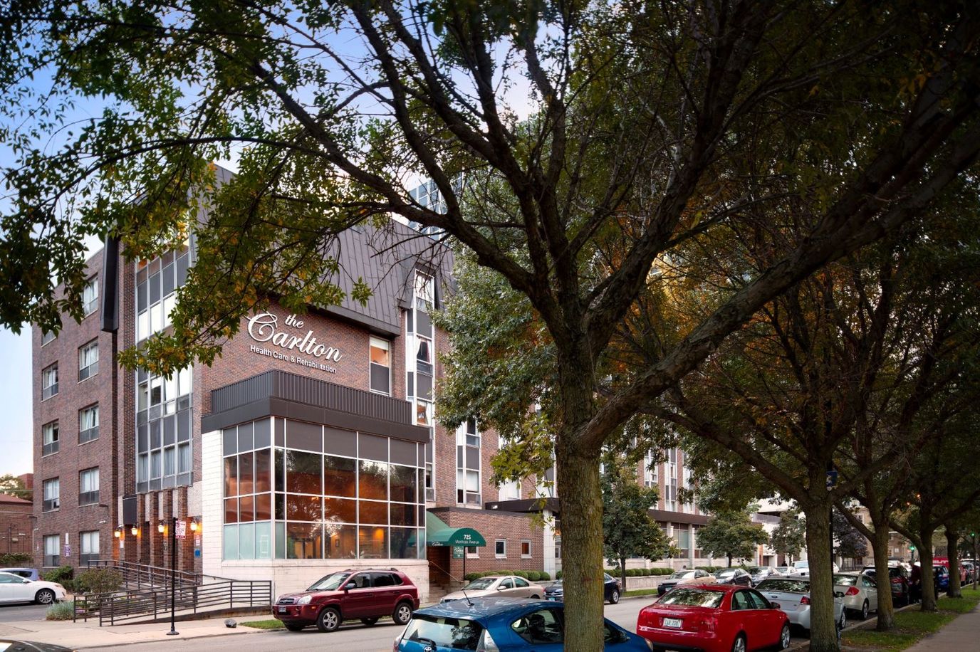 Exterior view of The Carlton facility with trees