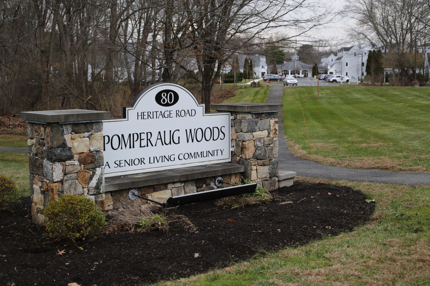 Sign for Pomperaug Woods senior living community