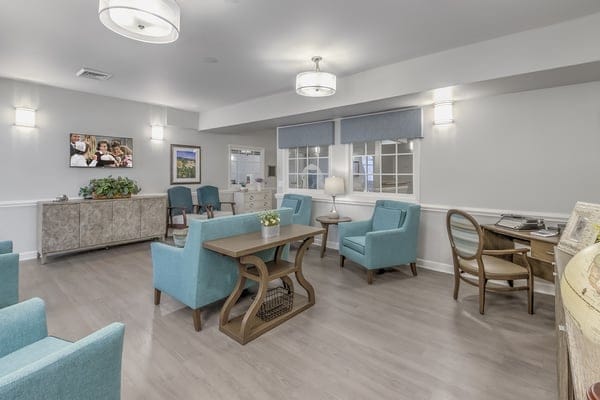 Cozy common area with blue chairs and decor