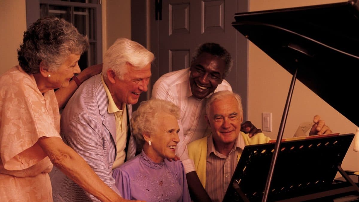 Residents enjoying piano music together.