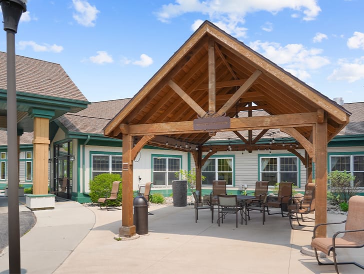 Outdoor patio area with seating and covered structure