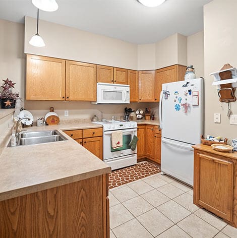 Modern kitchen layout with wooden cabinets and appliances