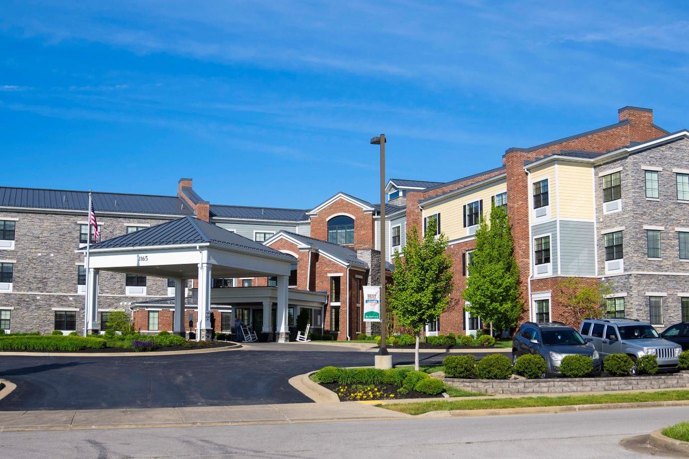 Exterior view of Cedarhurst of Beaumont with landscaped entrance