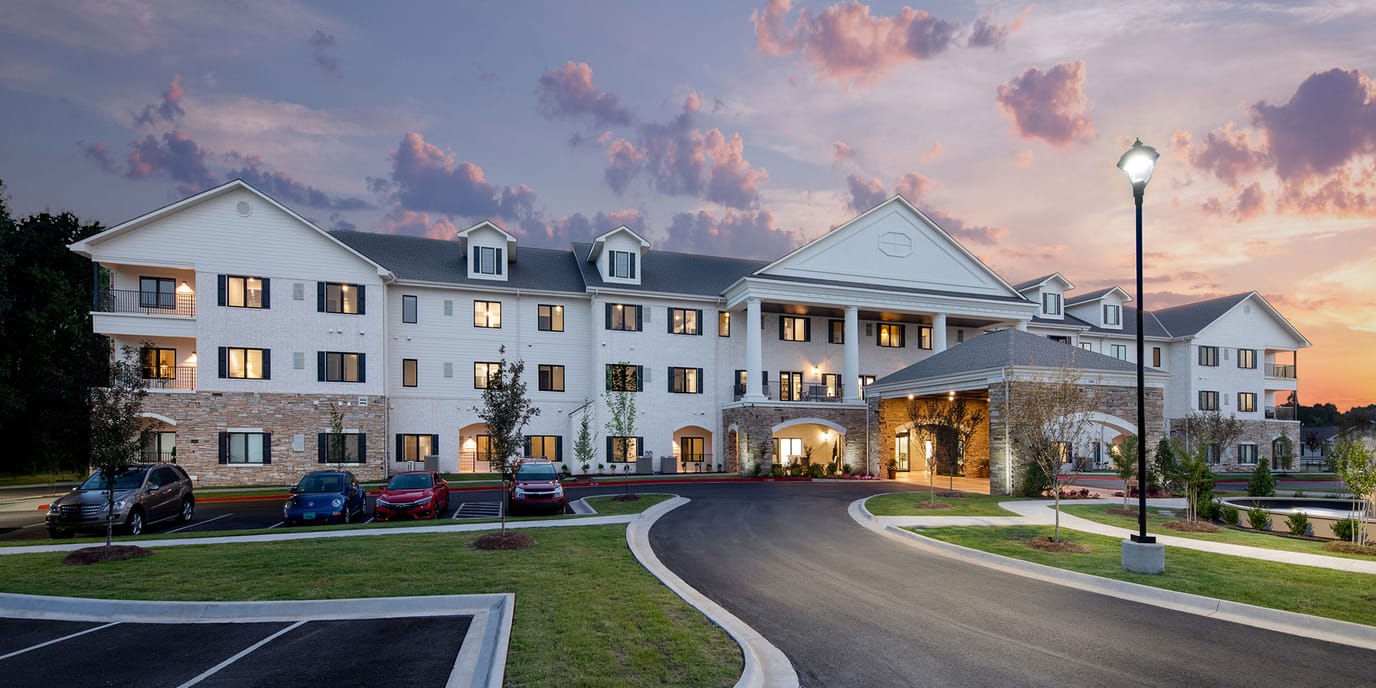 Exterior view of Grand Village at Clear Creek at sunset